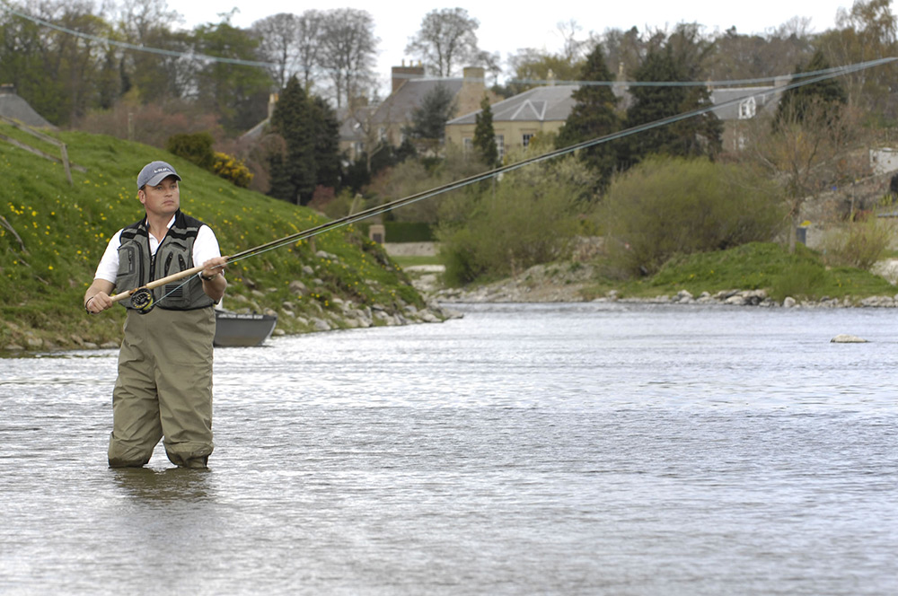 Salmon fisherman casts at the Junction Pool on the River Tweed, Kelso. Photo by Rob Gray